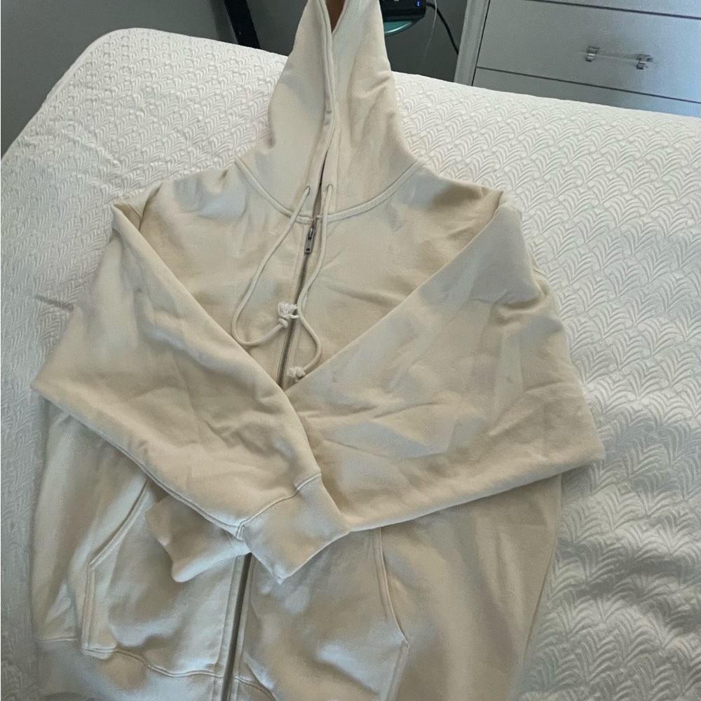 cream colored zip up hoodie